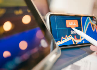 Trader examining Bitcoin, Ethereum, and forex opportunities across multiple markets