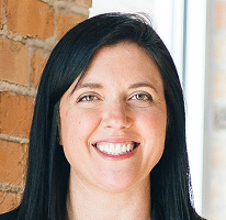 Sophie Hartwell, customer support head at a service organization, portrait.